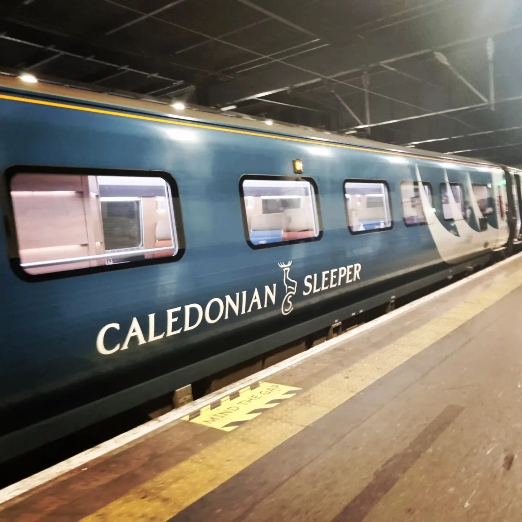 A train carriage that has 'Caledonian Sleeper' emblazoned on it